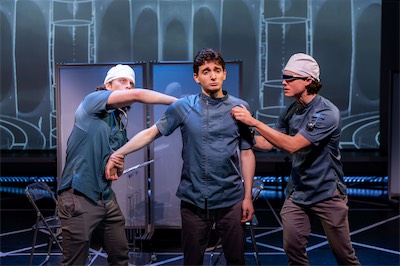 Nathan Reder as Surgeon 2, Aaron Greenberg as D-503 and Crosby Lloyd as Surgeon 1.