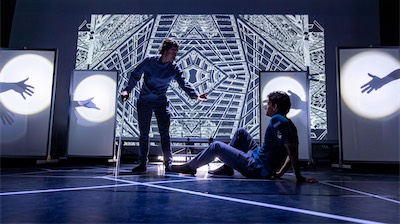 Crosby Lloyd as the Benefactor and Aaron Greenberg as D-503.