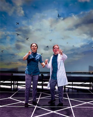 Rachel Fink as Messenger and John Teresi as Doctor.